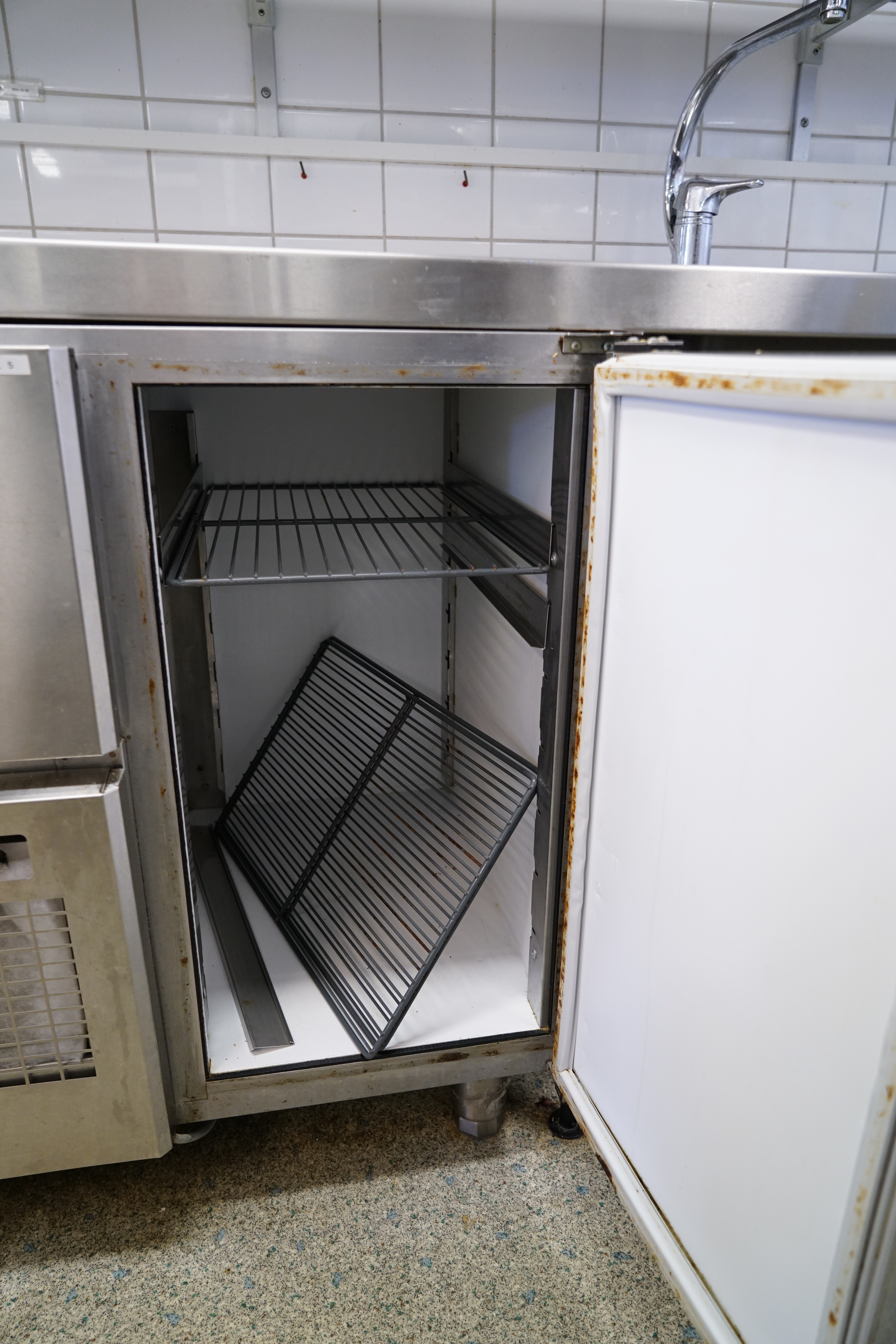 Stainless steel bench with hob and mixer, cooling bench and wall shelf ...