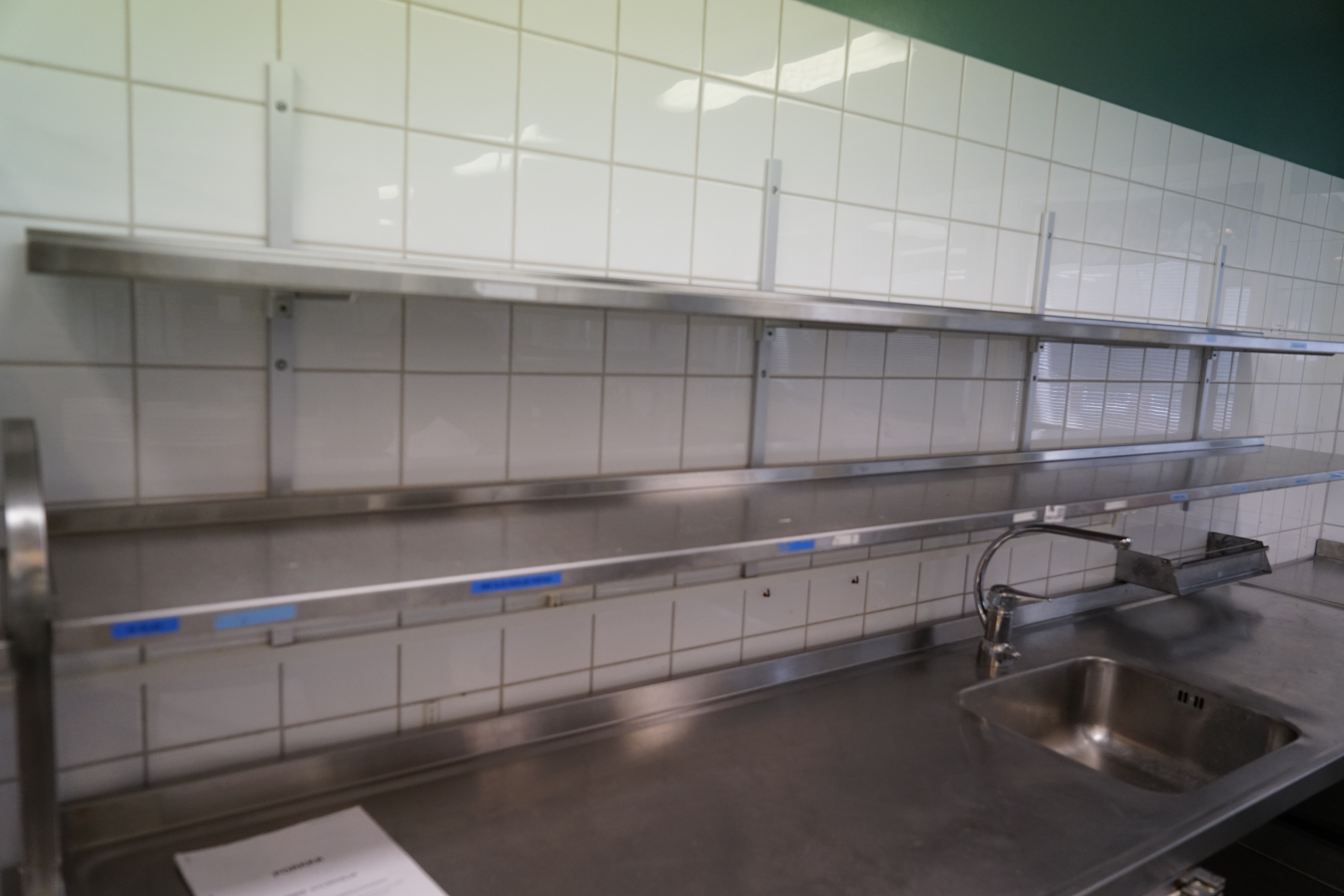 Stainless steel bench with hob and mixer, cooling bench and wall shelf ...
