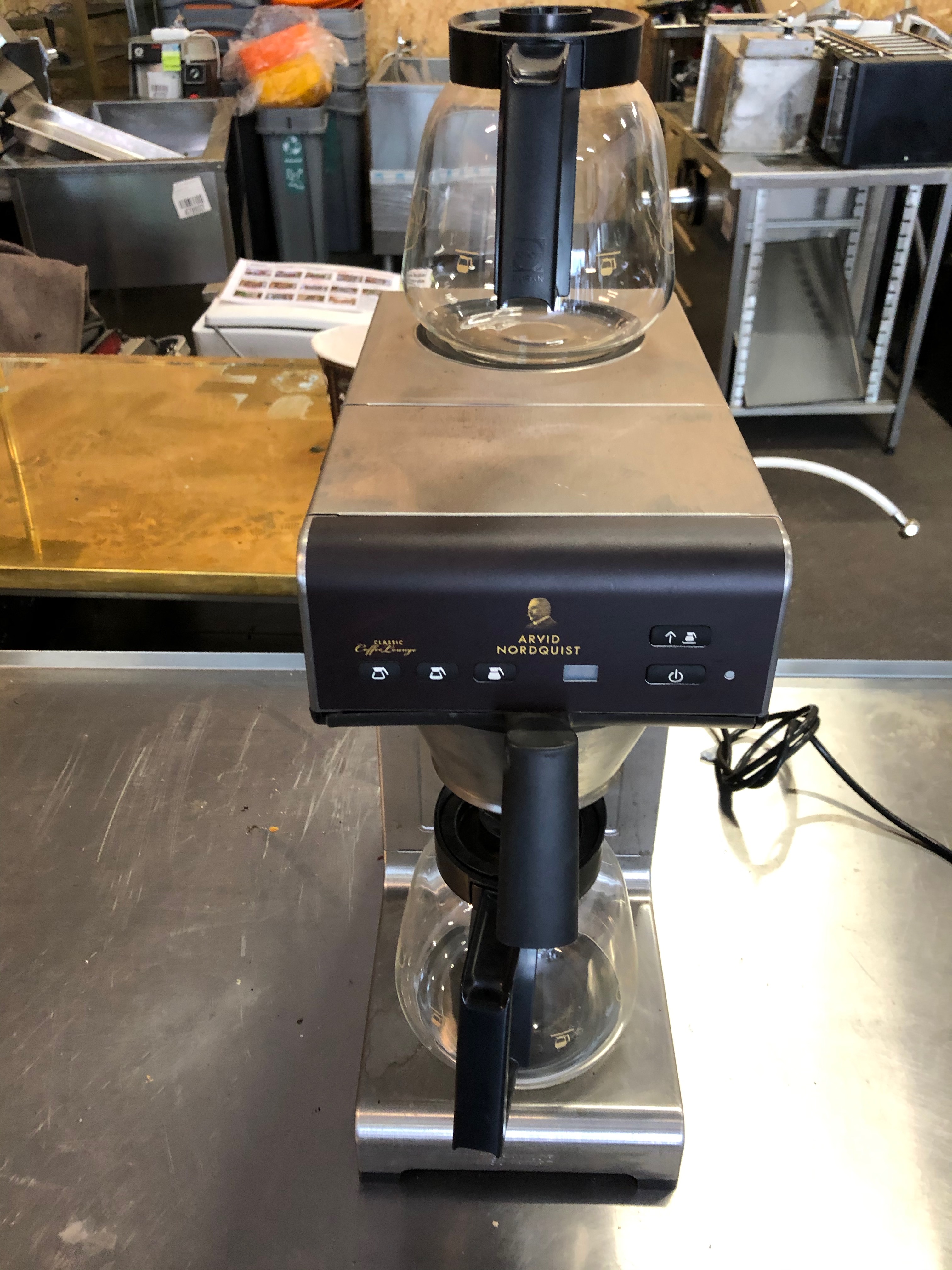 Coffee maker with 2 coffee pumps. Hot plate on top PS Auction We
