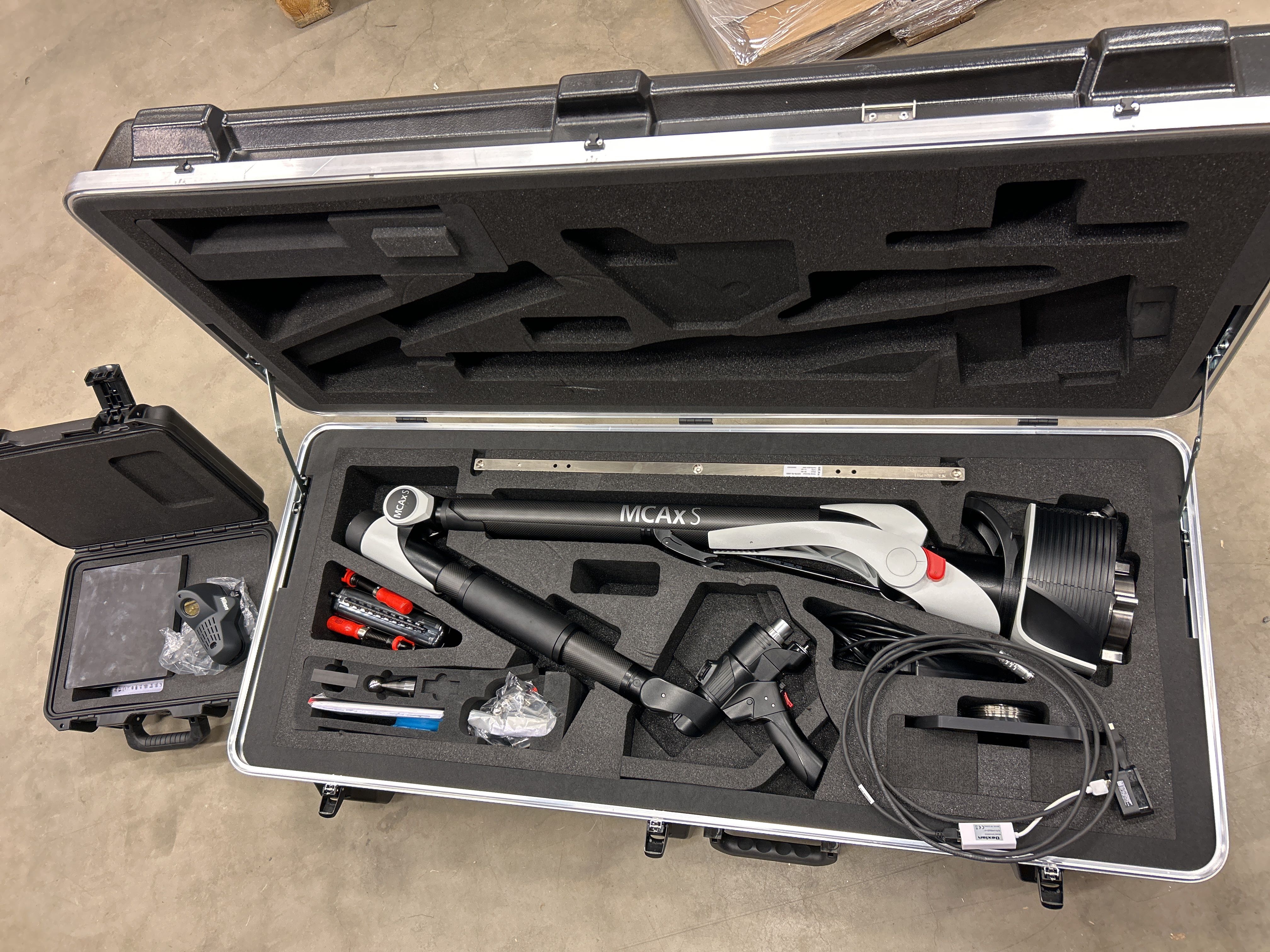 Portable coordinate measuring arm system with laser scanner