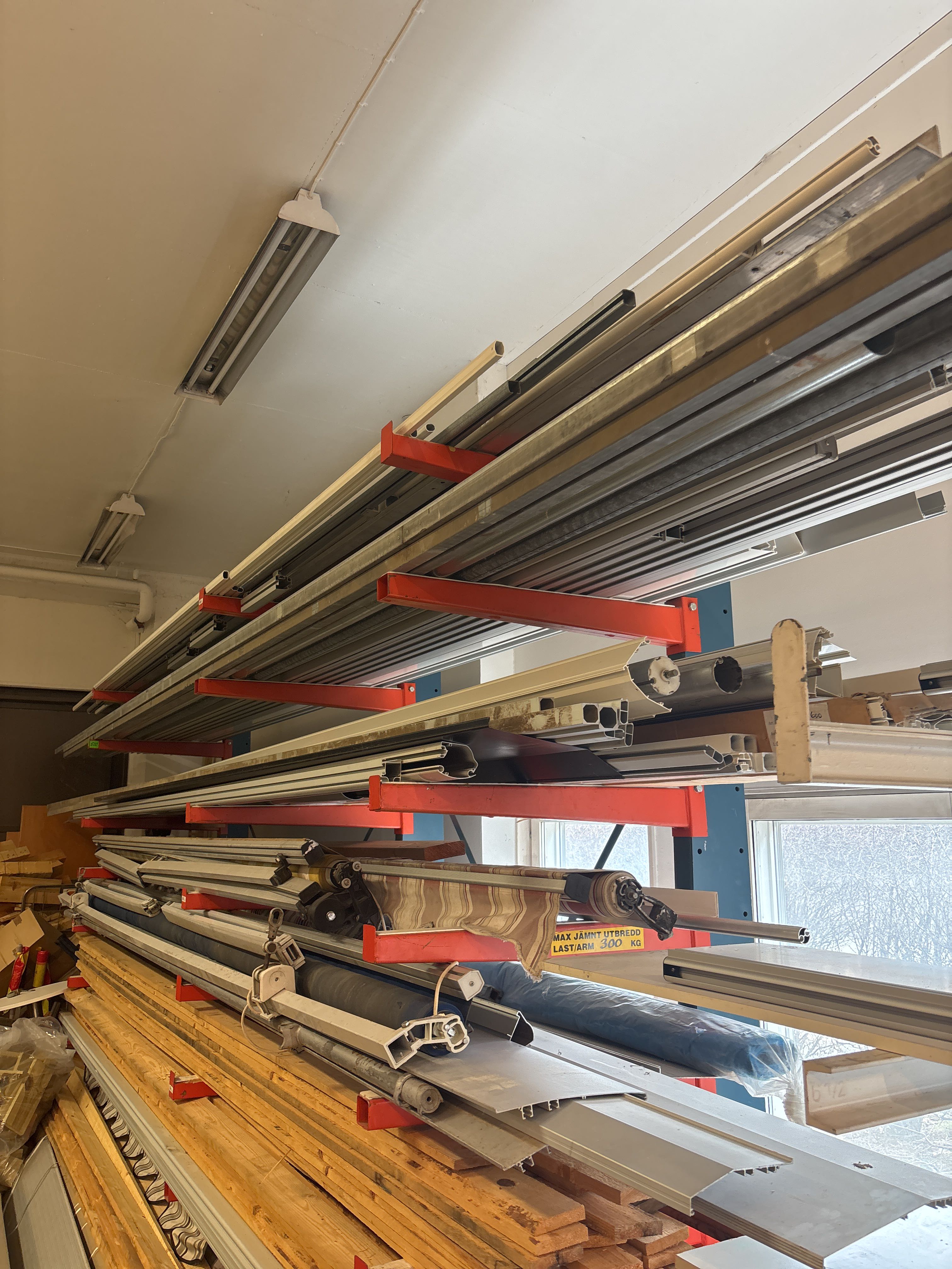 Tiered Part Racks 9-tiered sectional rack with contents - Wood materials, awning parts ...