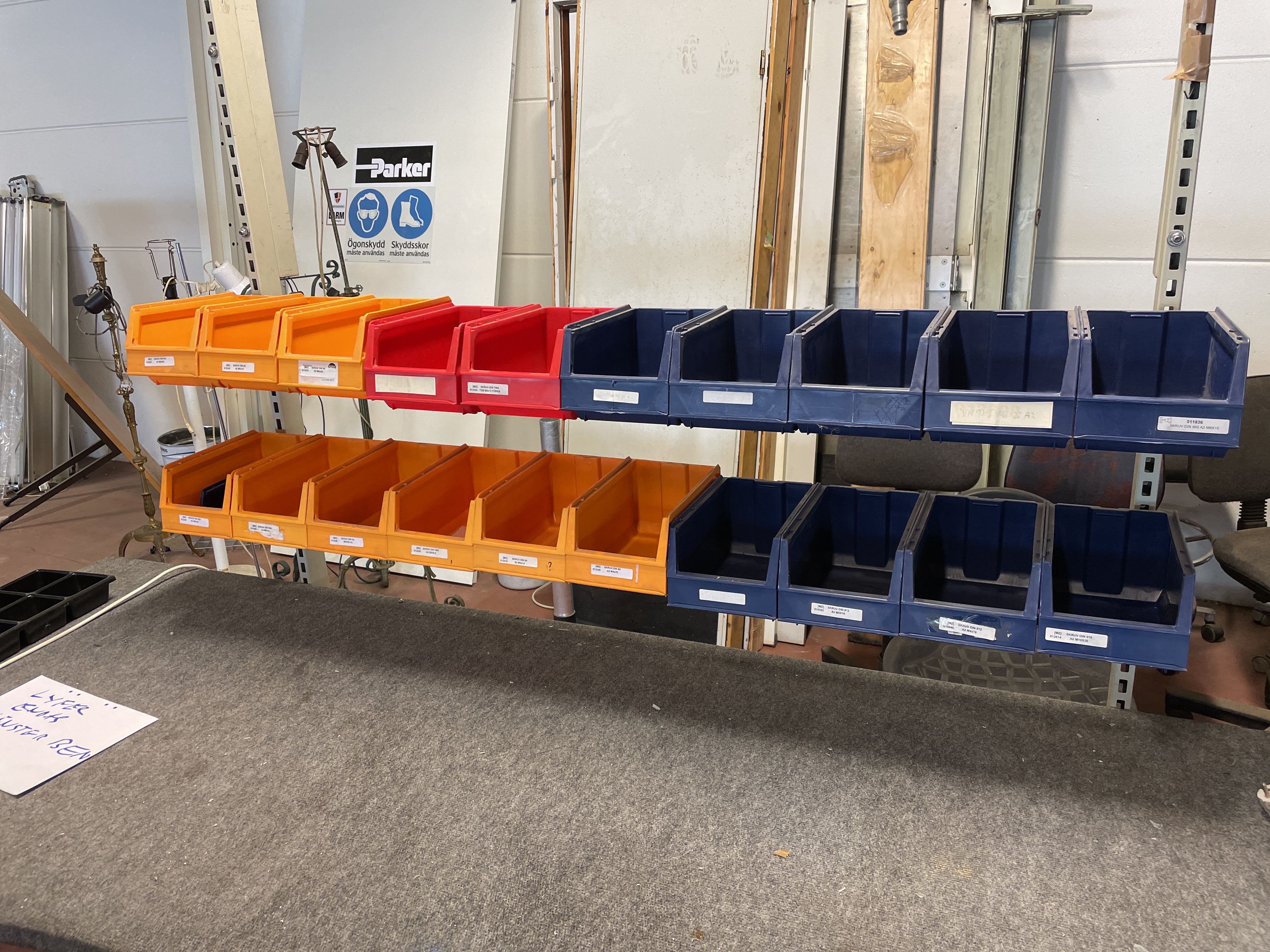 Raised and lowerable desk with assortment boxes on rack - PS Auction ...