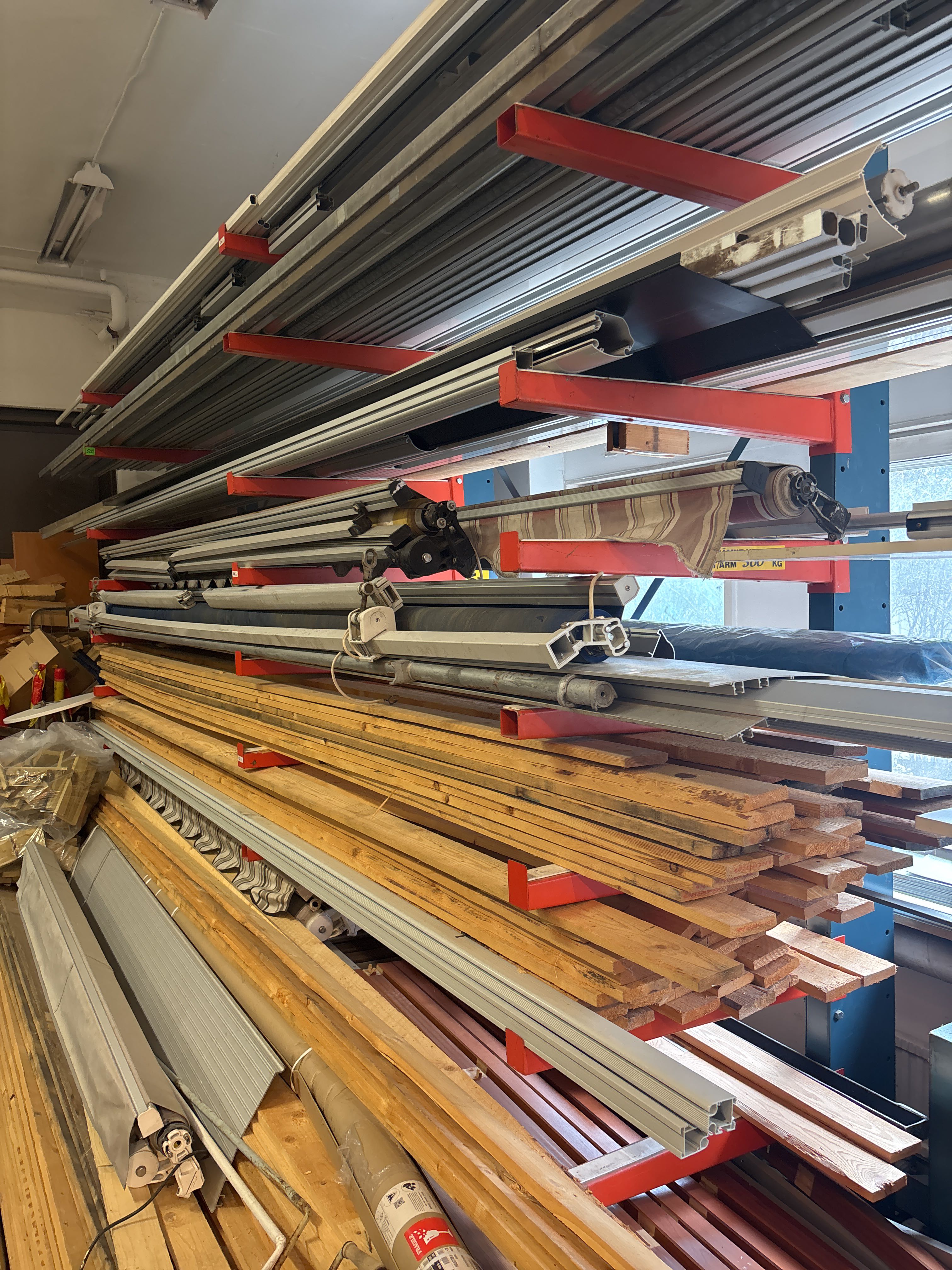 Tiered Part Racks 9-tiered sectional rack with contents - Wood materials, awning parts ...