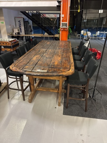 1458335-1 Bar table built from large door with 8 barstools