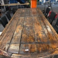 1458335-2 Bar table built from large door with 8 barstools
