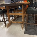 1458335-8 Bar table built from large door with 8 barstools