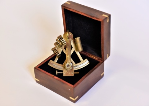 Brass sextant with maritime wooden box