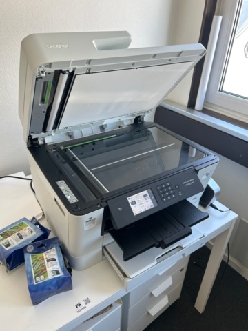 1531926-3 Table with printers, laminators and filing cabinets