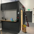 1550109-1 Shed/office module with motorized roller shutter door