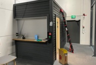 1550109 Shed/office module with motorized roller shutter door