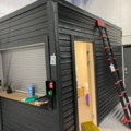 1550109-2 Shed/office module with motorized roller shutter door