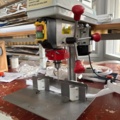 1546043-3 Drilling machine with rig for center drilling of pleated blinds