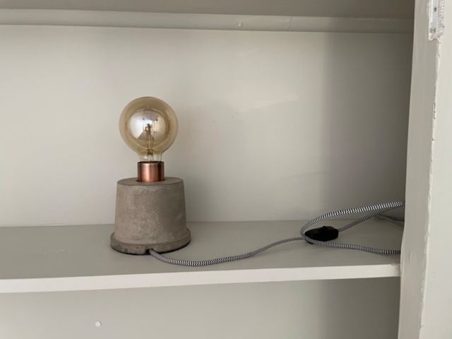 1557459-5 Books and lamp on bookshelf