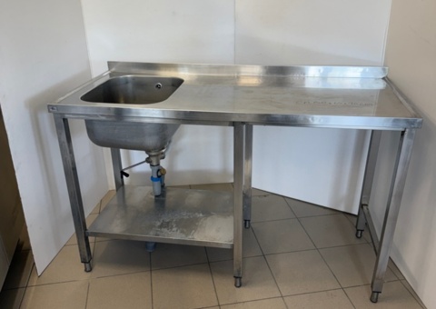 Sink with raised back edge, lower shelf, ball valve and space for an undercounter dishwasher