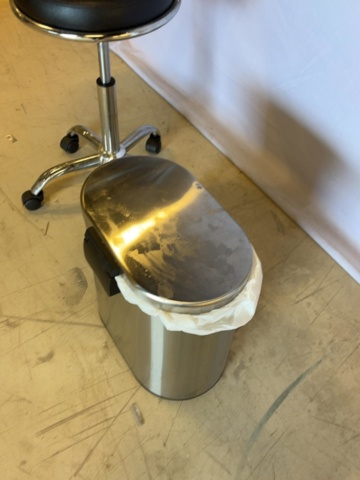 1549049-5 Rollaway stool with backrest and waste container