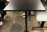 1563304 2 tables with black tabletop and column base