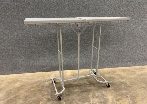 Mobile wardrobe with integrated hooks and metal shelves