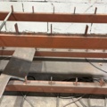 1546134-7 Metal cutting with rack and roller conveyor