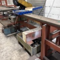 1546134-8 Metal cutting with rack and roller conveyor