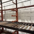 1546134-10 Metal cutting with rack and roller conveyor