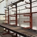1546134-12 Metal cutting with rack and roller conveyor