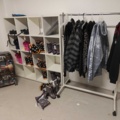 1485693-1 Collection of clothes, boots, suitcase, etc.