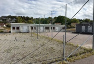 1565964 Football field and basketball court with fence
