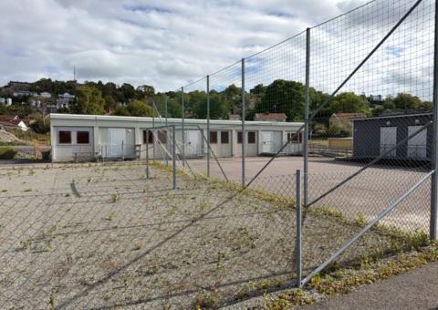 Football field and basketball court with fence