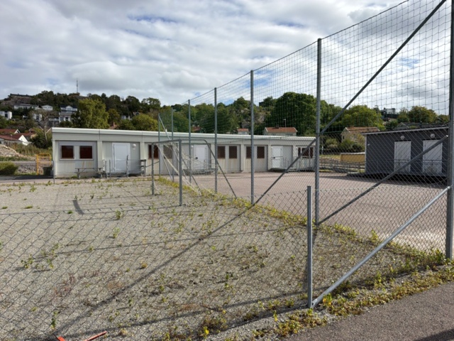 1565964-1 Football field and basketball court with fence