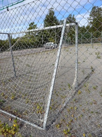 1565964-5 Football field and basketball court with fence