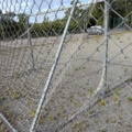 1565964-6 Football field and basketball court with fence