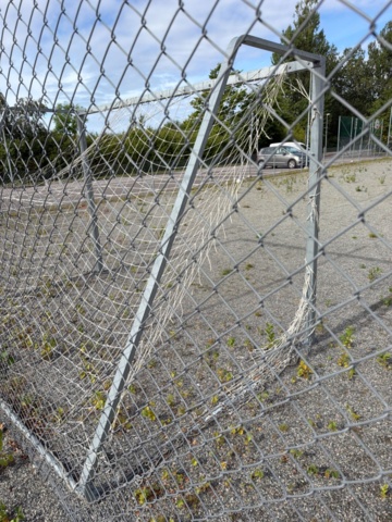 1565964-6 Football field and basketball court with fence