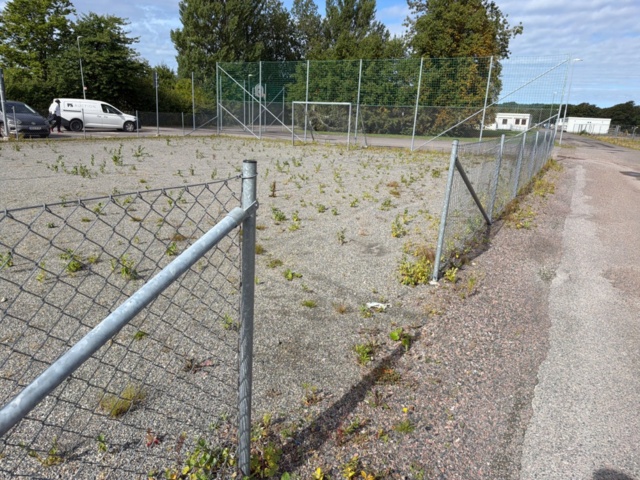 1565964-9 Football field and basketball court with fence