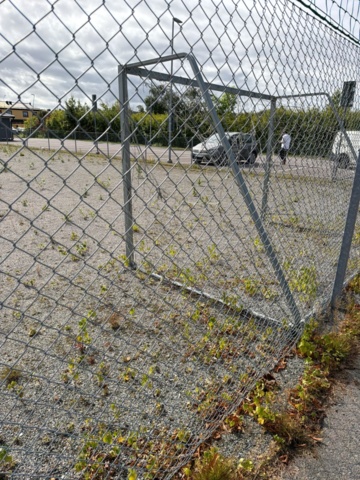 1565964-12 Football field and basketball court with fence