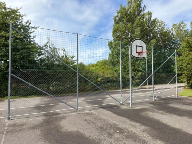 1565964-17 Football field and basketball court with fence
