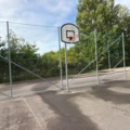 1565964-18 Football field and basketball court with fence