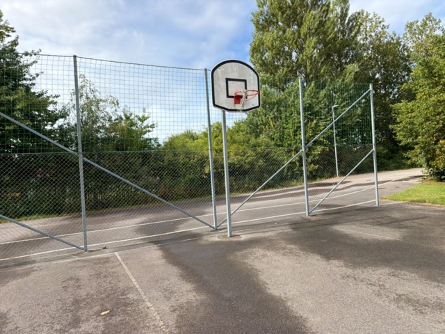 1565964-18 Football field and basketball court with fence