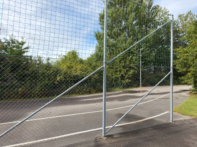 1565964-21 Football field and basketball court with fence