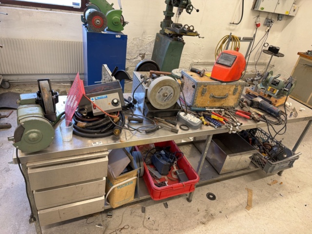 1566890-1 Collection of tools and workshop machines on workbench