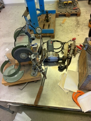 1566890-11 Collection of tools and workshop machines on workbench
