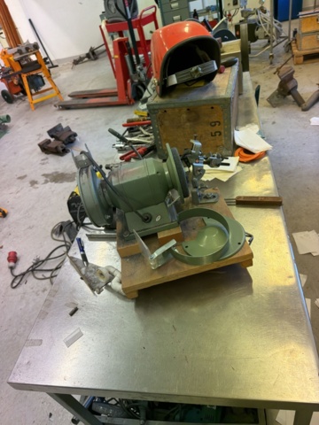 1566890-12 Collection of tools and workshop machines on workbench