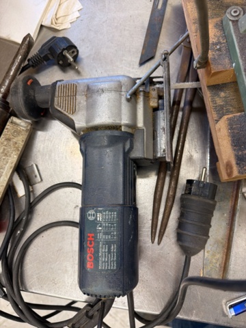 1566890-14 Collection of tools and workshop machines on workbench