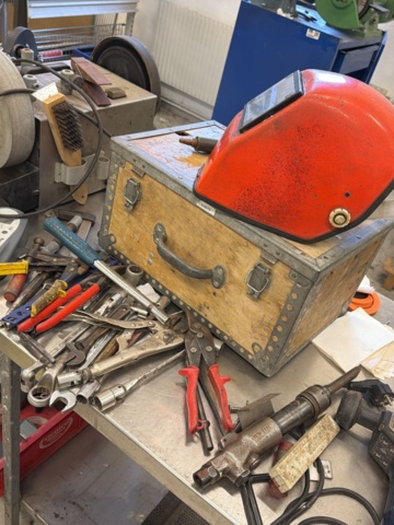 1566890-16 Collection of tools and workshop machines on workbench