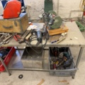 1566890-17 Collection of tools and workshop machines on workbench
