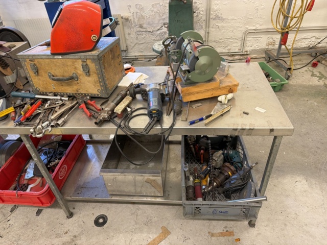 1566890-17 Collection of tools and workshop machines on workbench