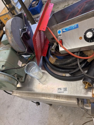1566890-22 Collection of tools and workshop machines on workbench