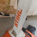 1485782-3 Stihl brushcutter with harness and helmet
