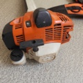 1485782-7 Stihl brushcutter with harness and helmet