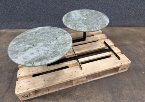 2 round tables with glass tops on stands