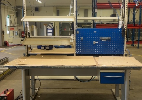 Height-adjustable work table with lighting and spring balancer